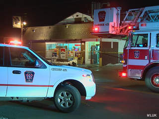 Firefighters respond to a fire at Dollar Land Inc., the former Beach Road Liquor, in Green Bay March 5, 2013. (courtesy of FOX 11). Firefighters respond to a fire at Dollar Land Inc., the former Beach Road Liquor, in Green Bay March 5, 2013. (courtesy of FOX 11).