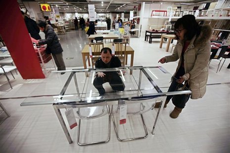 Customers check a table at an IKEA store in Beijing, February 22, 2013. REUTERS/Petar Kujundzic Customers check a table at an IKEA store in Beijing, February 22, 2013. REUTERS/Petar Kujundzic