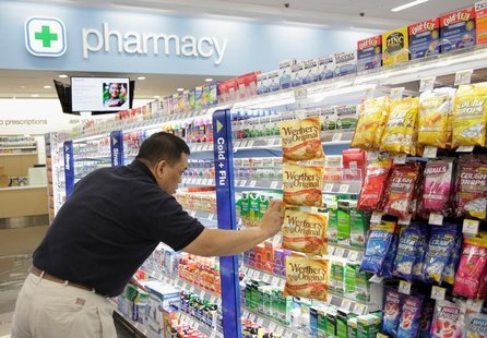 A worker stocks a new Walgreens store in Chicago January 9, 2012. REUTERS/John Gress A worker stocks a new Walgreens store in Chicago January 9, 2012. REUTERS/John Gress