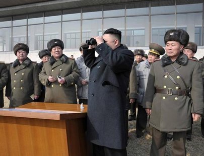 North Korean leader Kim Jong-Un (C) inspects an artillery firing drill of the Korean People's Army units in an undisclosed location in this North Korean leader Kim Jong-Un (C) inspects an artillery firing drill of the Korean People's Army units in an undisclosed location in this