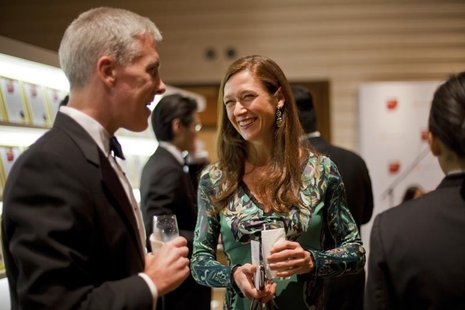Kate Richdale (C) talks to David Ryan, president of Goldman Sachs Asia Pacific, at the International Financing Review (IFR) Asia awards dinn Kate Richdale (C) talks to David Ryan, president of Goldman Sachs Asia Pacific, at the International Financing Review (IFR) Asia awards dinn
