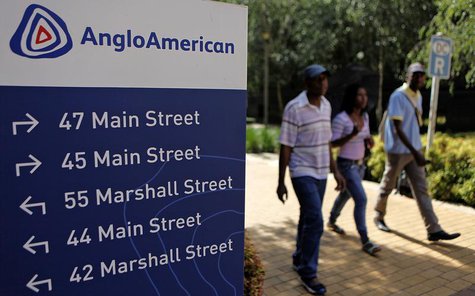 People walk past a board outside the Anglo American offices in Johannesburg January 8, 2013. REUTERS/Siphiwe Sibeko People walk past a board outside the Anglo American offices in Johannesburg January 8, 2013. REUTERS/Siphiwe Sibeko