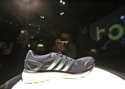 Attendees photograph the new Adidas Boost at the product launch in New York, February 13, 2013. REUTERS/Brendan McDermid Attendees photograph the new Adidas Boost at the product launch in New York, February 13, 2013. REUTERS/Brendan McDermid