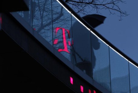 A man walks past the logo of Deutsche Telekom AG that is reflected on glass at their headquarters, in this file photo taken in Bonn December A man walks past the logo of Deutsche Telekom AG that is reflected on glass at their headquarters, in this file photo taken in Bonn December