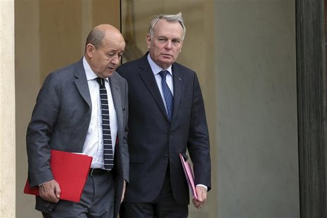 French Prime Minister Jean-Marc Ayrault (R) speaks with Defence minister Jean-Yves Le Drian at the end of a defence council at the Elysee Pa French Prime Minister Jean-Marc Ayrault (R) speaks with Defence minister Jean-Yves Le Drian at the end of a defence council at the Elysee Pa