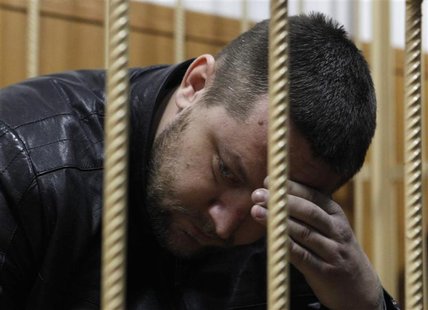 Yury Zarutsky sits in the defendant's holding cell during a court hearing in Moscow March 7, 2013. REUTERS/Maxim Shemetov Yury Zarutsky sits in the defendant's holding cell during a court hearing in Moscow March 7, 2013. REUTERS/Maxim Shemetov