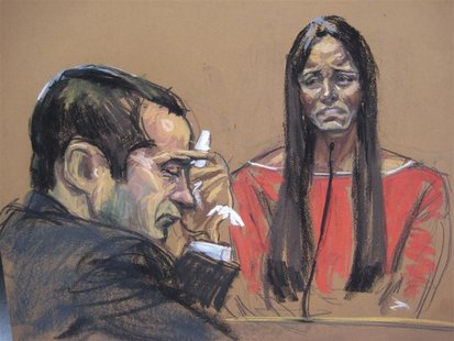 Former New York City police officer Gilberto Valle (L), dubbed by local media as the "Cannibal Cop", listens as his wife Kathleen Mangan tes Former New York City police officer Gilberto Valle (L), dubbed by local media as the "Cannibal Cop", listens as his wife Kathleen Mangan tes