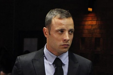 "Blade Runner" Oscar Pistorius stands in the dock during a break in court proceedings at the Pretoria Magistrates court February 20, 2013. R "Blade Runner" Oscar Pistorius stands in the dock during a break in court proceedings at the Pretoria Magistrates court February 20, 2013. R