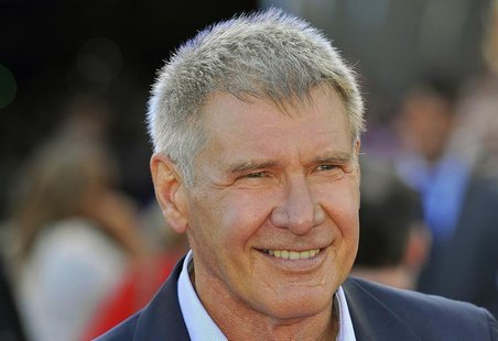 U.S. actor Harrison Ford poses for photographs as he arrives for the British premiere of "Cowboys and Aliens" at the O2 Arena in London Augu U.S. actor Harrison Ford poses for photographs as he arrives for the British premiere of "Cowboys and Aliens" at the O2 Arena in London Augu