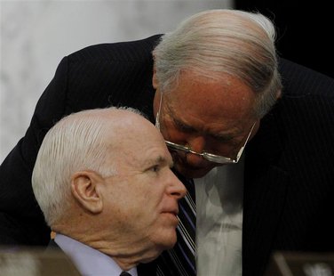 Chairman of the Senate Armed Services Committee Senator Carl Levin (D-MI) confers with committee member Senator John McCain (R-AZ) (L) in Wa Chairman of the Senate Armed Services Committee Senator Carl Levin (D-MI) confers with committee member Senator John McCain (R-AZ) (L) in Wa