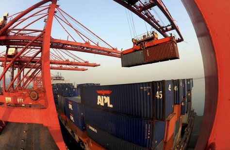 A crane loads containers at a port in Lianyungang, Jiangsu province January 10, 2013. REUTERS/China Daily A crane loads containers at a port in Lianyungang, Jiangsu province January 10, 2013. REUTERS/China Daily