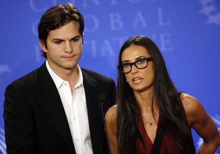 Actors Ashton Kutcher (L) and Demi Moore announce the launch of their "Real Men" campaign at a news conference during the Clinton Global Ini Actors Ashton Kutcher (L) and Demi Moore announce the launch of their "Real Men" campaign at a news conference during the Clinton Global Ini