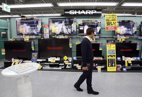 A man looks around Sharp's TV sets at an electronic shop in Tokyo February 1, 2013. REUTERS/Yuya Shino A man looks around Sharp's TV sets at an electronic shop in Tokyo February 1, 2013. REUTERS/Yuya Shino