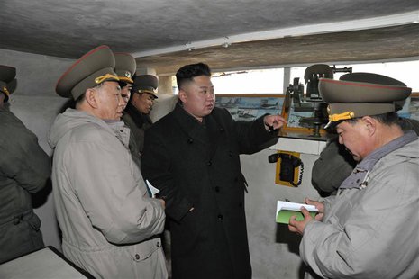 North Korean leader Kim Jong-Un (C) talks with officers at a guard post during his visit to the Jangjae Islet Defence Detachment and Mu Isle North Korean leader Kim Jong-Un (C) talks with officers at a guard post during his visit to the Jangjae Islet Defence Detachment and Mu Isle