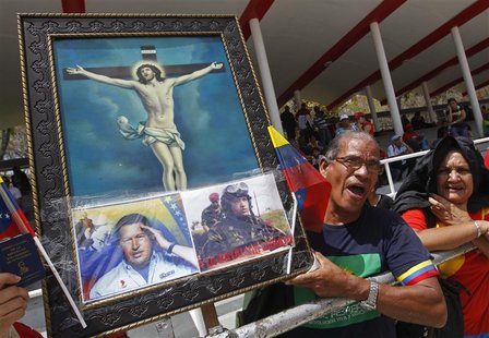 Supporters of Venezuela's late President Hugo Chavez stand in line to view his body in state at the Military Academy in Caracas, March 7, 20 Supporters of Venezuela's late President Hugo Chavez stand in line to view his body in state at the Military Academy in Caracas, March 7, 20