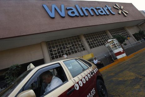 A taxi driver waits outside a Wal-Mart store in Mexico City January 11, 2013. REUTERS/Edgard Garrido A taxi driver waits outside a Wal-Mart store in Mexico City January 11, 2013. REUTERS/Edgard Garrido