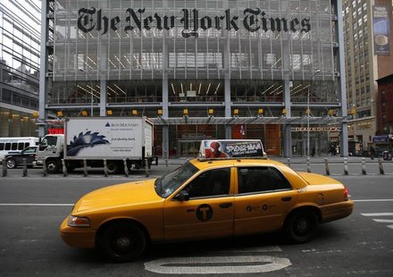 A taxi passes by in front of The New York Times head office in New York, February 7, 2013. REUTERS/Carlo Allegri A taxi passes by in front of The New York Times head office in New York, February 7, 2013. REUTERS/Carlo Allegri