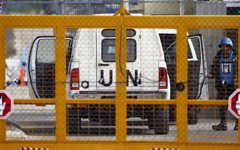 A Filipino United Nations peacekeepers enters a car at the Kuneitra border crossing between Israel and Syria, close to the ceasefire line be A Filipino United Nations peacekeepers enters a car at the Kuneitra border crossing between Israel and Syria, close to the ceasefire line be
