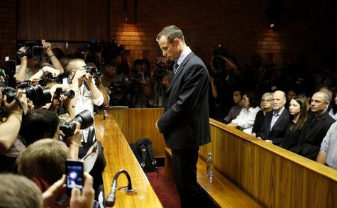 Oscar Pistorius stands at the dock before the start of proceedings at a Pretoria magistrates court February 22, 2013. REUTERS/Mike Hutchings Oscar Pistorius stands at the dock before the start of proceedings at a Pretoria magistrates court February 22, 2013. REUTERS/Mike Hutchings