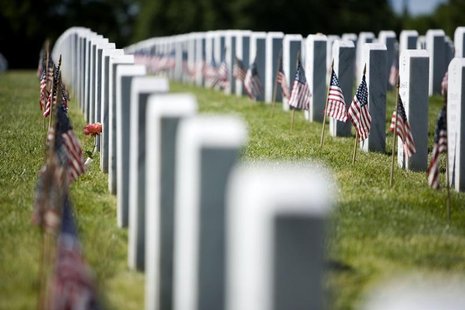 Flags stand in front of graves at Arlington National Cemetery ahead of Memorial Day in Washington, DC, May 24, 2008. REUTERS/Joshua Roberts Flags stand in front of graves at Arlington National Cemetery ahead of Memorial Day in Washington, DC, May 24, 2008. REUTERS/Joshua Roberts