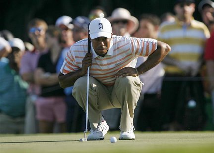 Tiger Woods of the U.S. looks at his putt on the 13th hole during second round play in the 2013 WGC-Cadillac Championship PGA golf tournamen Tiger Woods of the U.S. looks at his putt on the 13th hole during second round play in the 2013 WGC-Cadillac Championship PGA golf tournamen