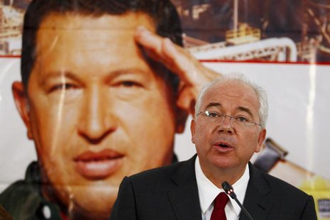 Venezuela's Energy Minister Rafael Ramirez talks to the media in front of a giant picture of Venezuela's President Hugo Chavez during a news Venezuela's Energy Minister Rafael Ramirez talks to the media in front of a giant picture of Venezuela's President Hugo Chavez during a news