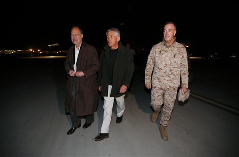 U.S. Secretary of Defense Chuck Hagel (C) walks with U.S. Ambassador to Afghanistan James Cunningham (L) and General Joseph Dunford, Command U.S. Secretary of Defense Chuck Hagel (C) walks with U.S. Ambassador to Afghanistan James Cunningham (L) and General Joseph Dunford, Command