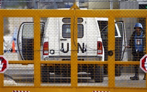 A Filipino United Nations peacekeepers enters a car at the Kuneitra border crossing between Israel and Syria, close to the ceasefire line be A Filipino United Nations peacekeepers enters a car at the Kuneitra border crossing between Israel and Syria, close to the ceasefire line be