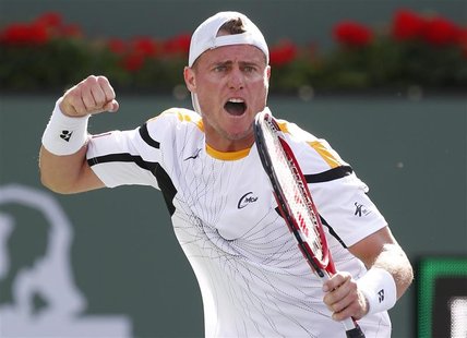 Lleyton Hewitt of Australia celebrates defeating John Isner of the U.S. in their match at the BNP Paribas Open ATP tennis tournament in Indi Lleyton Hewitt of Australia celebrates defeating John Isner of the U.S. in their match at the BNP Paribas Open ATP tennis tournament in Indi