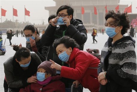 Tourists wearing masks visit Tiananmen Square in Beijing March 9, 2013. Beijing's air quality deteriorated again as a sandstorm and thick sm Tourists wearing masks visit Tiananmen Square in Beijing March 9, 2013. Beijing's air quality deteriorated again as a sandstorm and thick sm
