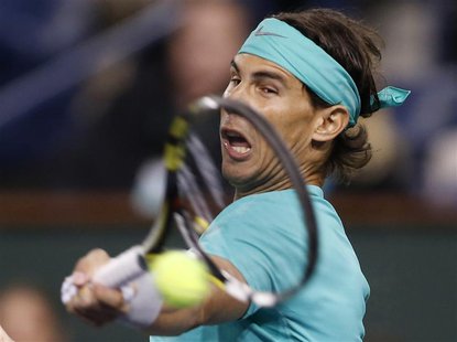 Rafael Nadal of Spain hits a return against Ryan Harrison of the U.S. during their match at the BNP Paribas Open ATP tennis tournament in In Rafael Nadal of Spain hits a return against Ryan Harrison of the U.S. during their match at the BNP Paribas Open ATP tennis tournament in In
