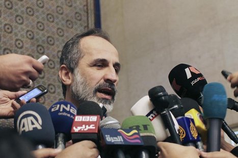 Syrian National Coalition leader Moaz Alkhatib speaks to the media after meeting with Arab League head Nabil al-Arabi in Cairo February 11, Syrian National Coalition leader Moaz Alkhatib speaks to the media after meeting with Arab League head Nabil al-Arabi in Cairo February 11,