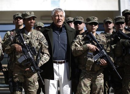 U.S. Secretary of Defense Chuck Hagel (C) poses for a picture with members of the U.S. Army and Marines during his visit to the Kabul Milita U.S. Secretary of Defense Chuck Hagel (C) poses for a picture with members of the U.S. Army and Marines during his visit to the Kabul Milita