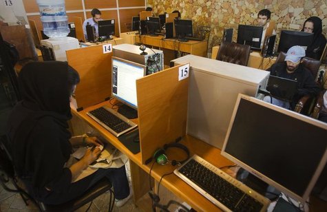 Customers use computers at an internet cafe in Tehran May 9, 2011. REUTERS/Raheb Homavandi Customers use computers at an internet cafe in Tehran May 9, 2011. REUTERS/Raheb Homavandi