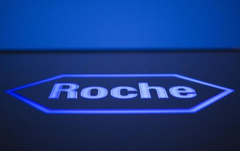A logo of Swiss pharmaceutical company Roche is pictured in front of a company's building in Rotkreuz, April 12, 2012. REUTERS/Michael Buhol A logo of Swiss pharmaceutical company Roche is pictured in front of a company's building in Rotkreuz, April 12, 2012. REUTERS/Michael Buhol