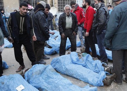 Residents attempt to identify bodies found along a river, at a school used as a field hospital in Aleppo's Bustan al-Qasr January 29, 2013. Residents attempt to identify bodies found along a river, at a school used as a field hospital in Aleppo's Bustan al-Qasr January 29, 2013.