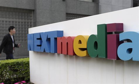 A man walks past the logo of Next Media at its headquarters in Taipei January 21, 2013. REUTERS/Pichi Chuang A man walks past the logo of Next Media at its headquarters in Taipei January 21, 2013. REUTERS/Pichi Chuang