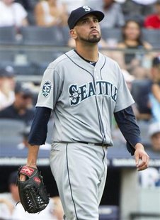 Seattle Mariners relief pitcher Oliver Perez reacts after he gave up a two-run single to New York Yankees batter Raul Ibanez in the sixth in Seattle Mariners relief pitcher Oliver Perez reacts after he gave up a two-run single to New York Yankees batter Raul Ibanez in the sixth in