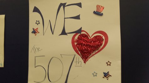 The gym was decorated with hand made signs welcoming the troops home. The gym was decorated with hand made signs welcoming the troops home.