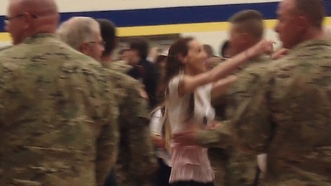 After the troops were formally dismissed from formation, family members, especially wives and husbands rushed down from the stands to find their soldiers. After the troops were formally dismissed from formation, family members, especially wives and husbands rushed down from the stands to find their soldiers.