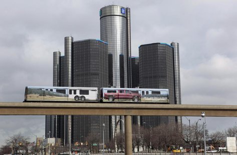 Two cars of the 'people mover' public rail are seen covered with a advertisement for the 2014 Chevy Silverado pickup truck as they move past Two cars of the 'people mover' public rail are seen covered with a advertisement for the 2014 Chevy Silverado pickup truck as they move past