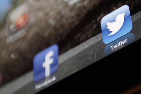 An illustration picture shows the log-on icon for the Website Facebook and Twitter on an Ipad in Bordeaux, Southwestern France, January 30, An illustration picture shows the log-on icon for the Website Facebook and Twitter on an Ipad in Bordeaux, Southwestern France, January 30,