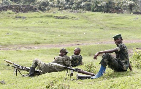 M23 rebel fighters guard the venue of a news conference in Bunagana in eastern Democratic Republic of Congo January 3, 2013. REUTERS/James A M23 rebel fighters guard the venue of a news conference in Bunagana in eastern Democratic Republic of Congo January 3, 2013. REUTERS/James A