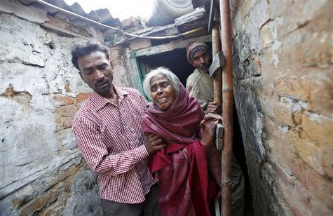 The brother, mother and father (L-R) of Ram Singh, the driver of the bus in which a young woman was gang-raped and fatally injured three mon The brother, mother and father (L-R) of Ram Singh, the driver of the bus in which a young woman was gang-raped and fatally injured three mon
