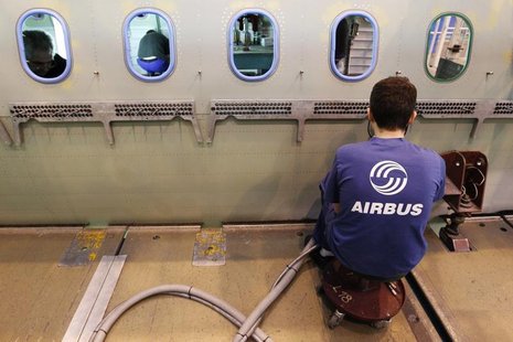 An Airbus employee works in a fuselage section of an A320 Airbus airplane at the Airbus facility in Montoir-de-Bretagne near Saint-Nazaire J An Airbus employee works in a fuselage section of an A320 Airbus airplane at the Airbus facility in Montoir-de-Bretagne near Saint-Nazaire J