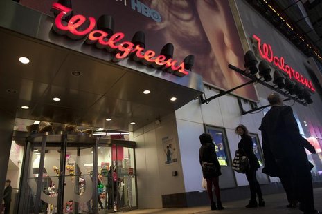 Shoppers walk by at the Walgreens' Times Square store in New York December 17, 2012. REUTERS/Andrew Kelly Shoppers walk by at the Walgreens' Times Square store in New York December 17, 2012. REUTERS/Andrew Kelly