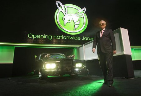 Howard Stringer, Chairman, CEO and President of Sony Corporation of America, is shown on stage as actors Seth Rogan and Jay Chou leave in a Howard Stringer, Chairman, CEO and President of Sony Corporation of America, is shown on stage as actors Seth Rogan and Jay Chou leave in a