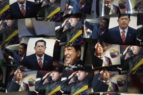 Photos of the late President Hugo Chavez are hung out for sale outside of the Military Academy, where the funeral service of Chavez is being Photos of the late President Hugo Chavez are hung out for sale outside of the Military Academy, where the funeral service of Chavez is being