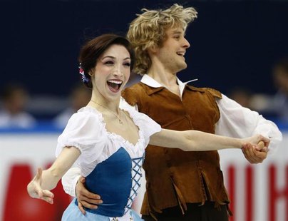Meryl Davis and Charlie White of the U.S. perform during the ice dance short dance competition at the ISU Grand Prix of Figure Skating Final Meryl Davis and Charlie White of the U.S. perform during the ice dance short dance competition at the ISU Grand Prix of Figure Skating Final