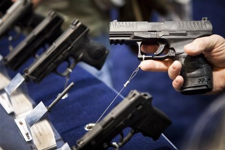 A Walther handgun is displayed at the Smith & Wesson booth at the Safari Club International Convention in Reno, Nevada, January 29, 2011. RE A Walther handgun is displayed at the Smith & Wesson booth at the Safari Club International Convention in Reno, Nevada, January 29, 2011. RE